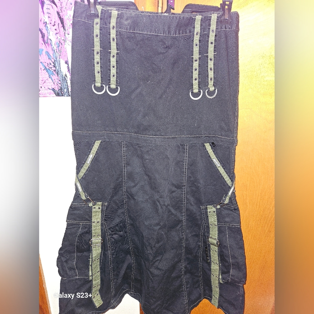 Tripp black with camo green accents, convertible skirt.